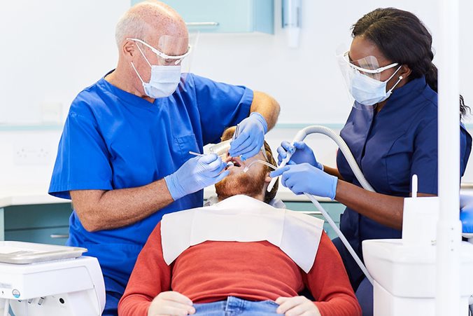 Patient receiving treatment by dentist